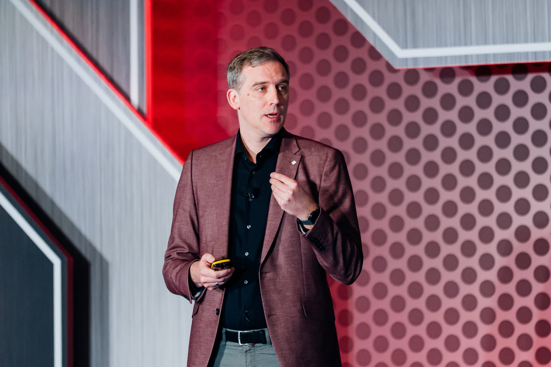 Corporate event photography of an executive presenting on stage at a leading Tampa Bay conference venue